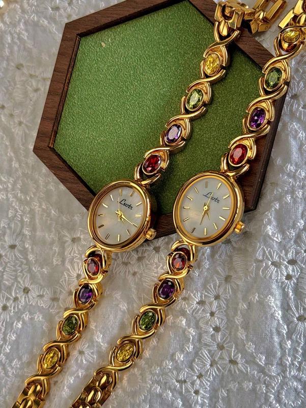 High-End Luxury Women's Watch with Colorful Tourmalines, Diamonds, and Mother of Pearl Dial