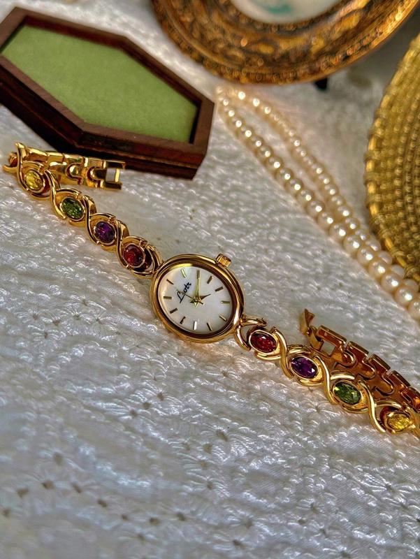 High-End Luxury Women's Watch with Colorful Tourmalines, Diamonds, and Mother of Pearl Dial